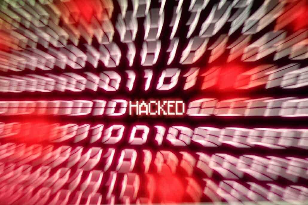 hacked-computer-binary-number-stream-blurred-conce-DLGRX2L