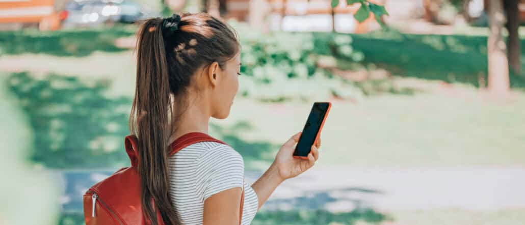 Student using their phone outside of school