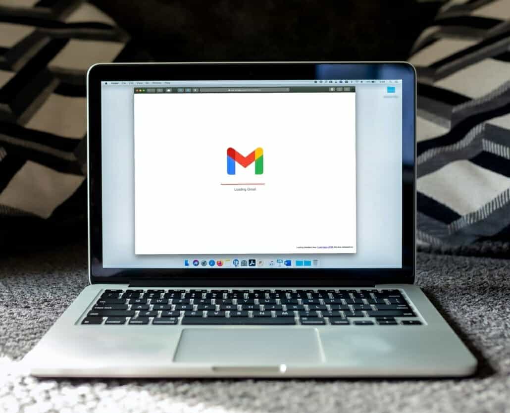 A person accessing their email on their laptop at work after going through email security measures.