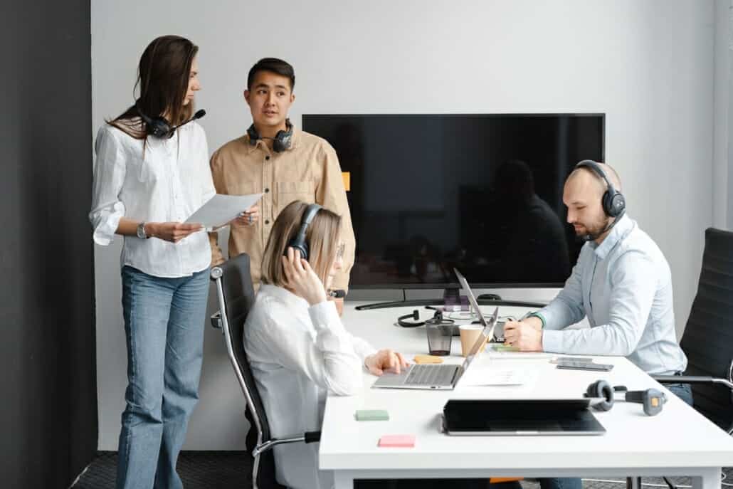 People in an office discussing Why Response Time is Important for their MSP.