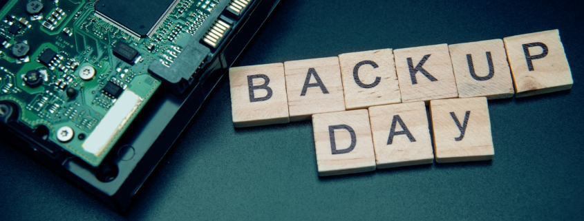hard disk on black dark background with selective focus and crop fragment. Business, backup March 31st and technology concept. Words in English Backup day. Copy space for text. HDD hard drive