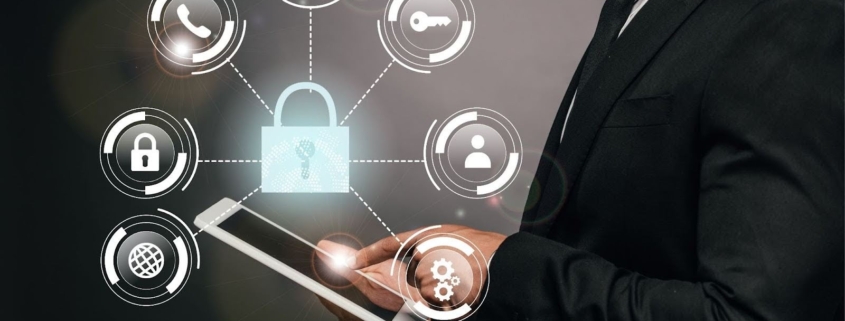 Man in suit holding tablet with infographic of lock, phone, key etc. IT management Concept