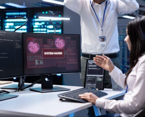 Team of developers in server hub frightened by hacker passing firewall