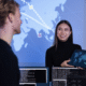 Smiling cyber security team working in a Cyber Security Operations Center