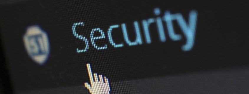 Computer screen displaying the word security with a cursor icon, representing IT security risk and access control