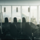 Modern executive conference room with floor-to-ceiling windows overlooking a city skyline, representing strategic technology leadership and business growth.