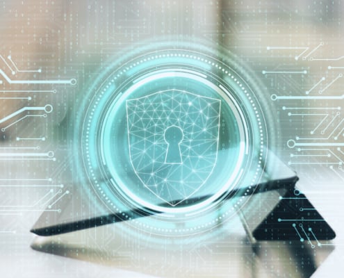 digital cybersecurity padlock shield displayed over tablet representing endpoint protection and network security for business devices