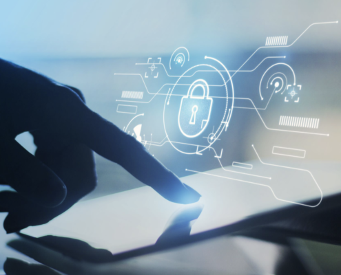 Hand using tablet with digital lock interface representing cybersecurity protection and data security