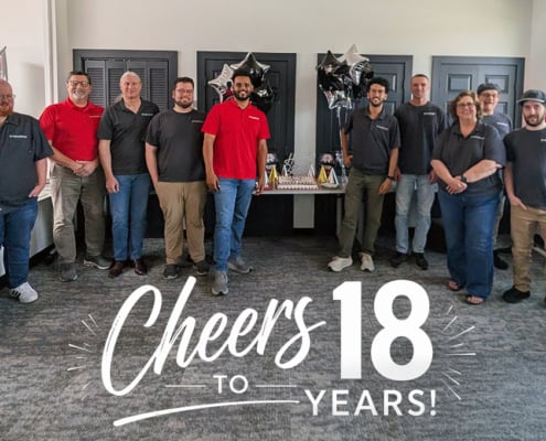 Bastionpoint Technology team celebrates 18 years in Richmond with balloons, cake, and a “Cheers to 18 Years” anniversary graphic.