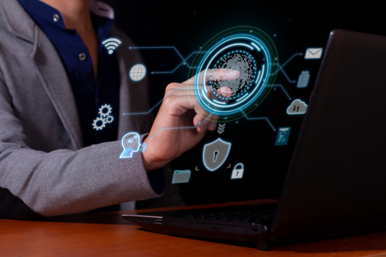 A business professional uses a fingerprint scanner on a digital interface beside a laptop, surrounded by cybersecurity, cloud, Wi-Fi, AI, and data icons.
