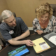 Bastionpoint Technology team member reviews documents with a client during an IT consultation.